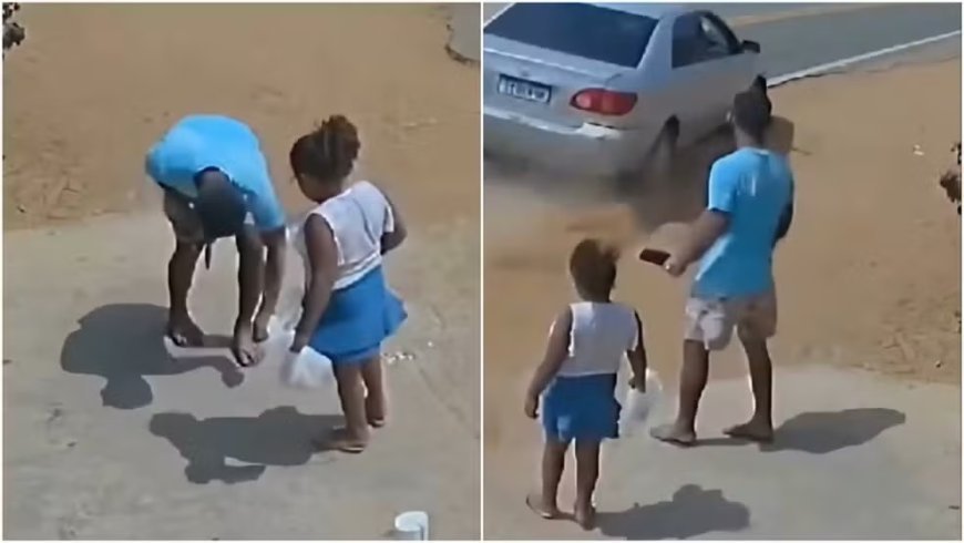 Pai e filha param para pegar moeda no chão e escapam de atropelamento; vídeo