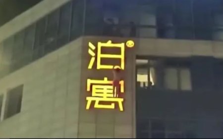 Amante é flagrado e fica pendurado em letreiro de hotel