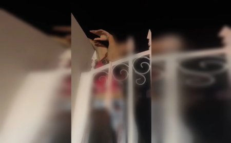 Jovem fica com braço preso em lança de portão ao pular muro de casa